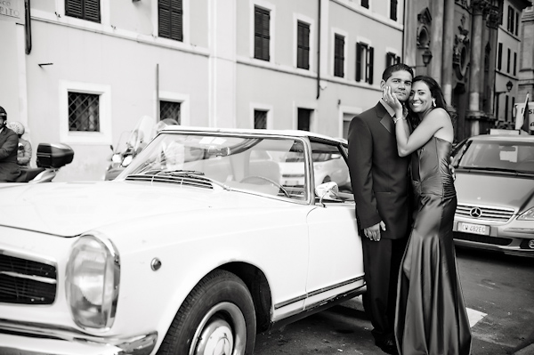 the happy couple standing by car - wedding photo by top Rome based destination wedding photographer Rochelle Cheever, Rome Weddings Photography